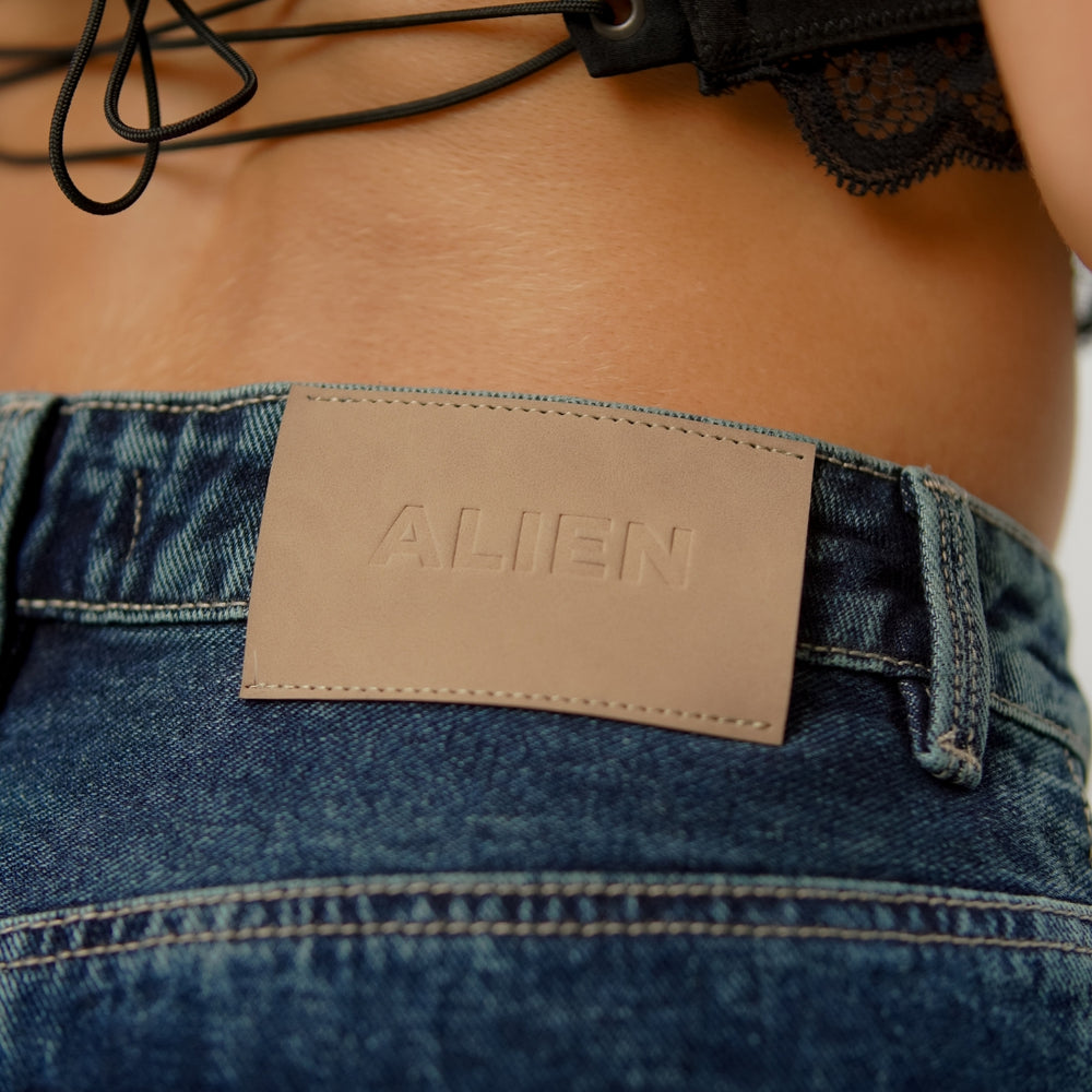 
                      
                        dark blue flare alien jeans
                      
                    
